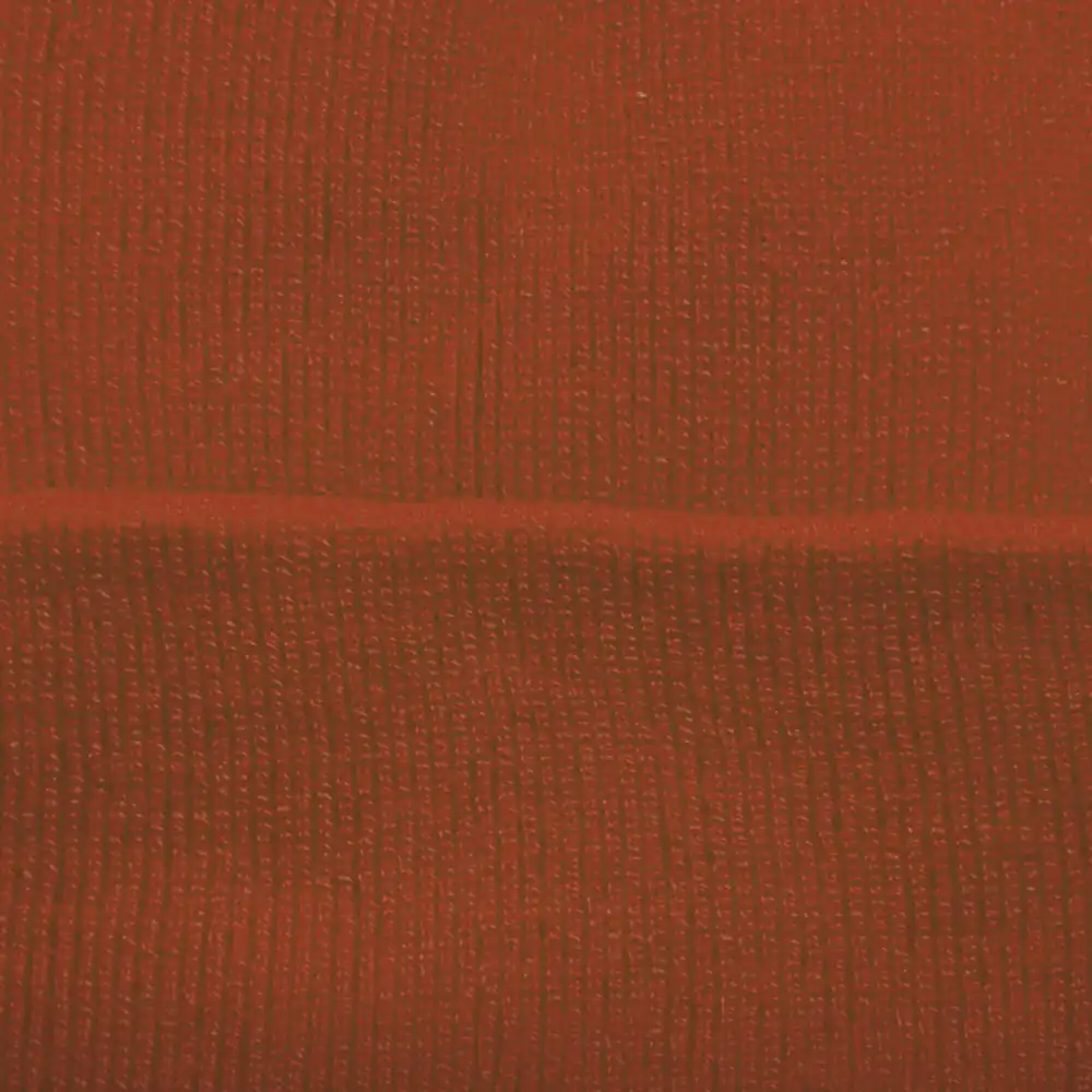Gorro Beanie Volcán en color naranja con textura cálida y moderna.